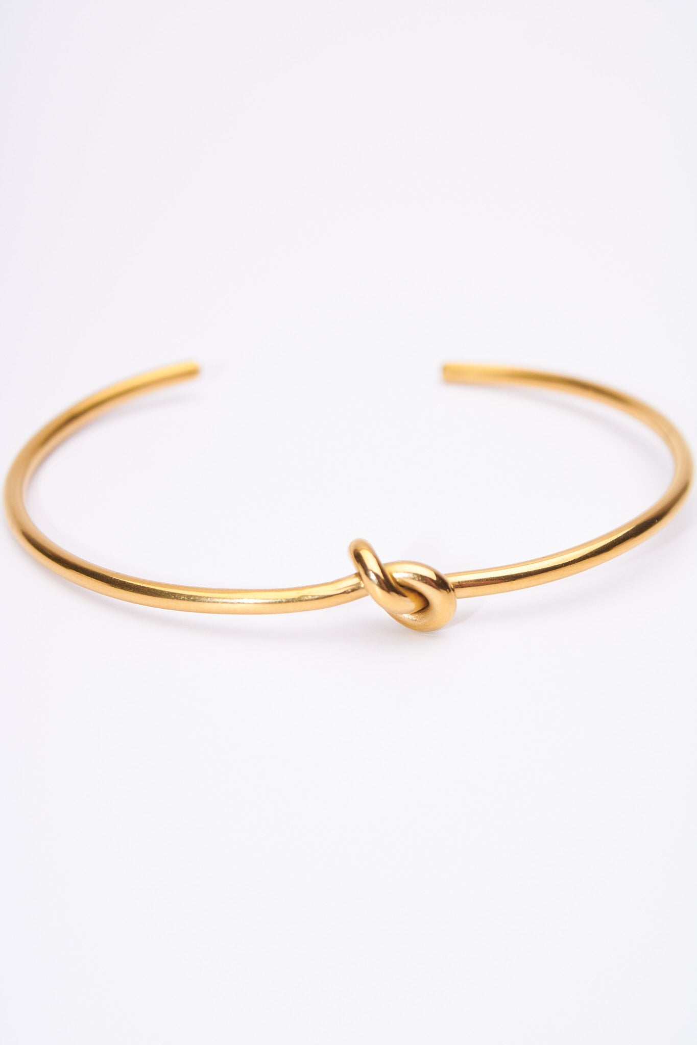 Pulsera rígida nudo dorado