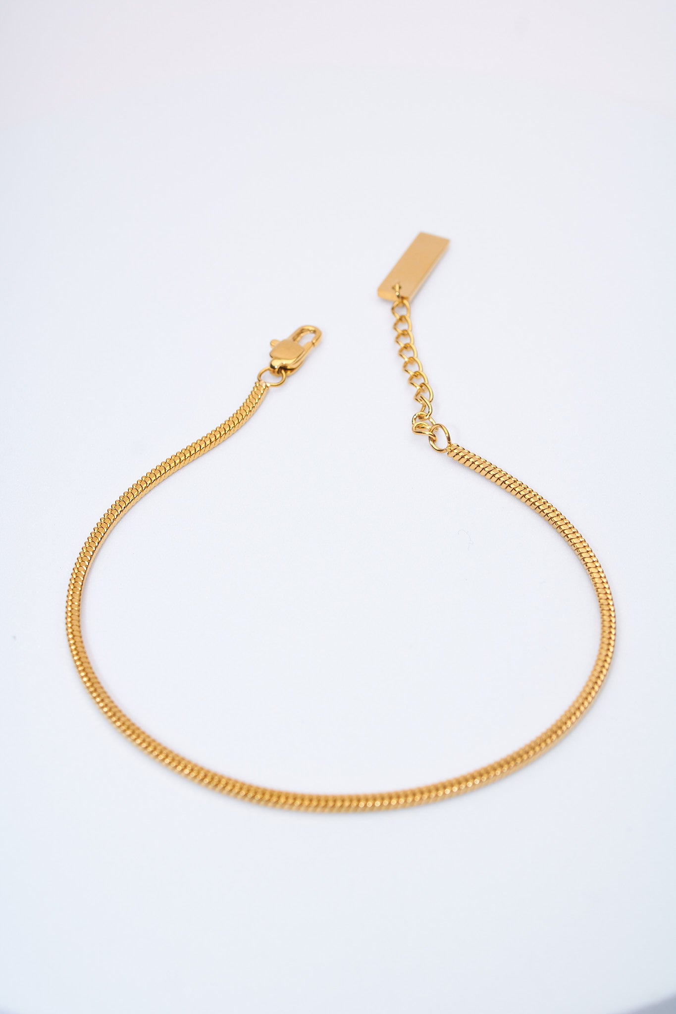 Pulsera cadena serpiente dorada — extensión ajustable