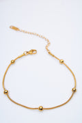 Pulsera fina con bolitas doradas — cadena serpiente