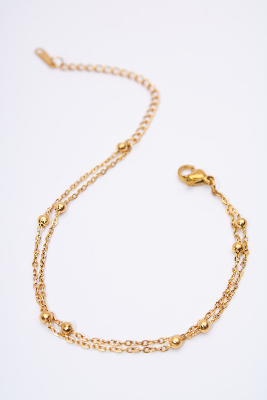 Pulsera doble capa con bolitas móviles — baño dorado