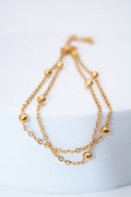 Pulsera doble capa con bolitas móviles — baño dorado