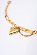 Pulsera eslabón mixto con corazón macizo — baño dorado