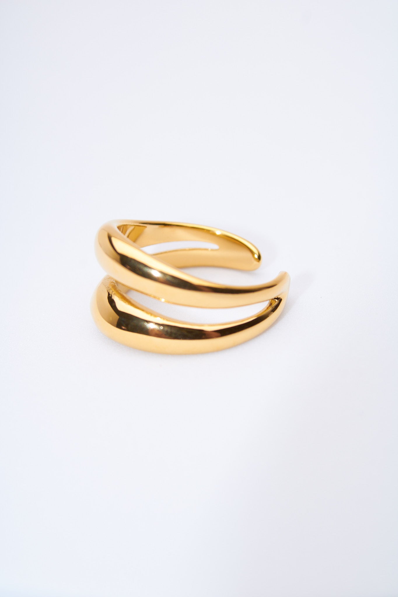 Pulsera rígida doble curva — baño dorado