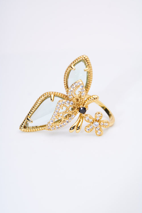Anillo mariposa dorada con cristales y alas facetadas