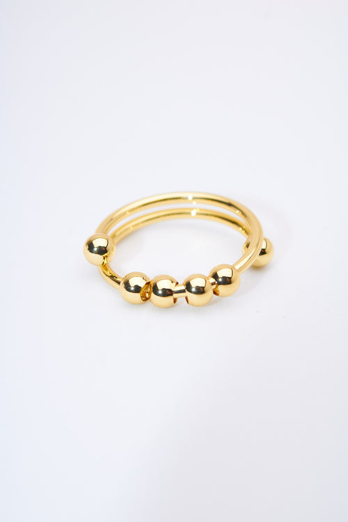 Anillo doble bandas con bolitas móviles — baño dorado