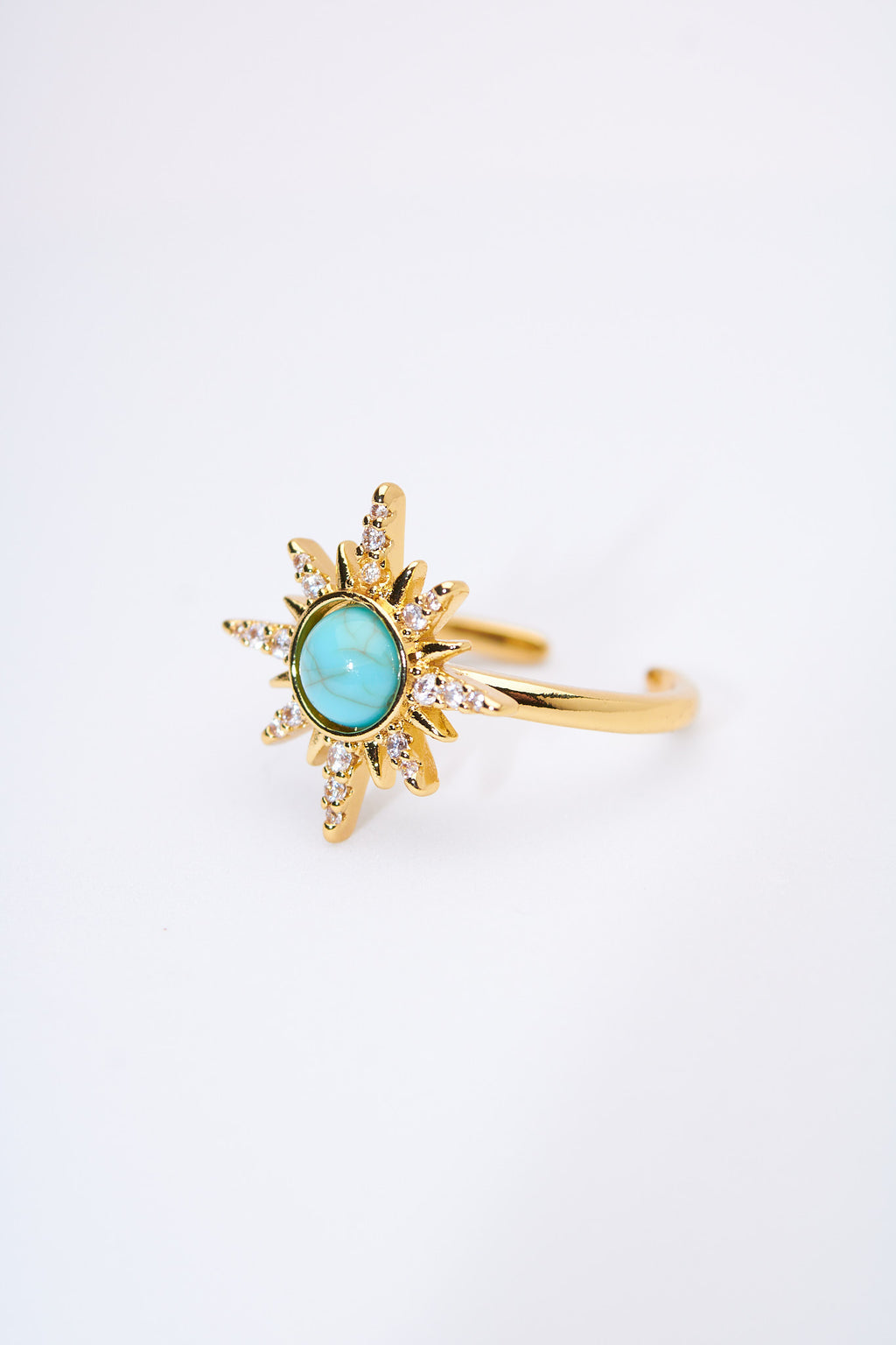 Anillo sol radiante con piedra turquesa — baño dorado